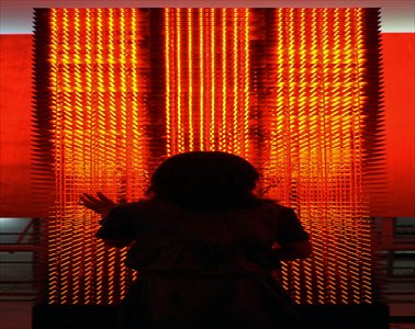 A visitor observing Xu Dongliang's Lightopia Photos: Courtesy of Fang Zhenning and cafa.com.cn