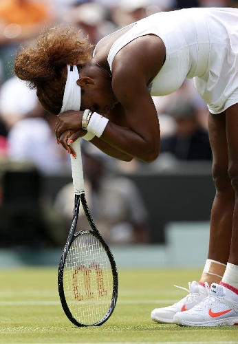 Serena Williams of the United States reacts during the second round of ladies' singles against Caroline Garcia of France on day 4 of the Wimbledon Lawn Tennis Championships at the All England Lawn Tennis and Croquet Club in London, Britain on June 27, 2013. Serena Williams won 2-0. (Xinhua/Wang Lili) 