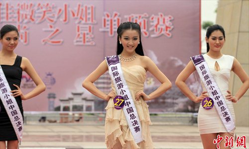 The China Final of 2013 Miss Tourism International rang down the curtain in Huangpi District of Wuhan, capital of central China's Hubei Province, May 5, 2013.  Photo: Chinanews.com