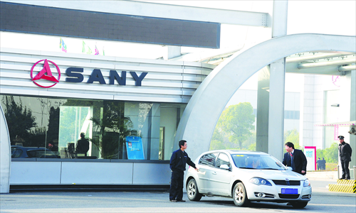 Men at the gate of a Sany production facility in Kunshan, Zhejiang Province.Photo: CFP
