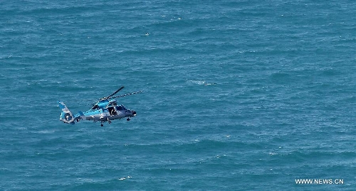 An Israeli air force helicopter operates next to a cruise ship off the coast of Haifa, northern Israel, Thursday, April 25, 2013. An Israeli Air Force F-16 fighter jet downed a drone off the coastline of the northern city of Haifa at noon of Thursday, the Israeli Defense Forces (IDF) said. (Xinhua/Jini) 