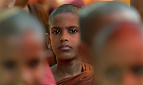 A Sri Lankan Buddhist monk attends a protest outside the Indian High Commission in Colombo on Wednesday. The demonstration was against attacks on Sri Lankans visiting the south Indian state of Tamil Nadu. Sri Lankan authorities have warned tour operators against sending pilgrims to Tamil Nadu following a spate of racial attacks. Photo: AFP