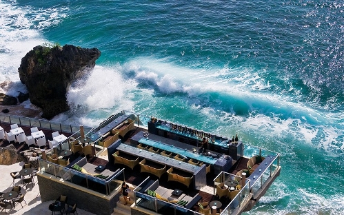 Ayana Resort & Spa's Rock Bar, Bali&nbsp; (Source: www.huanqiu.com)Drinking at Ayana Resort & Spa's Rock Bar in Bali is a dramatic experience.Guests access the waterfront bar, which is positioned at the bottom of a cliff face, by cable car and can hear the waves crash once settled at their tables.Visiting at dusk is recommended as sunsets are often spectacular.