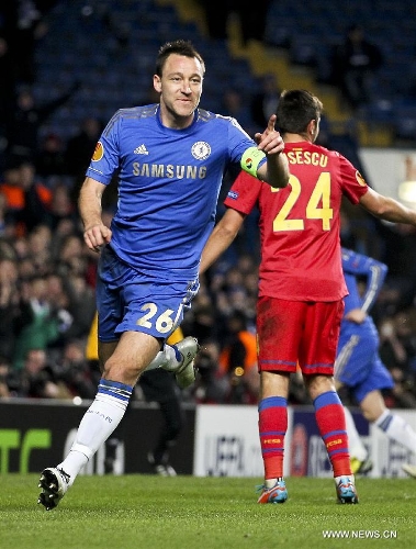 Chelsea's John Terry (L) celebrates scoring during their Europa League soccer match against Steaua Bucharest in London March 15, 2013. Chelsea won 3-1 and entered the next round by 3-2 on aggregate. (Xinhua/Tang Shi) 