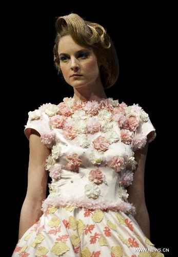 A model presents a creation of Indonesian brand Jeanny Ang Couture's 2013 spring/summer series at the 11th 