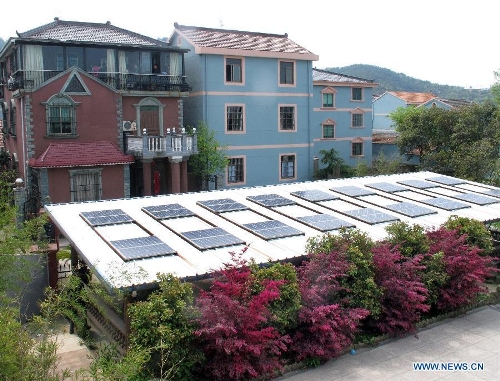 Photo taken on April 8, 2013 shows a homemade photovoltaic power station made by a local resident named Mo Zhikai in Wumeng Village of Ningbo City, east China's Zhejiang Province.&nbsp; (Xinhua/Gong Guorong) 