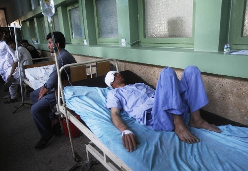 An injured man receives treatment at a hospital in east Afghanistan's Nangarhar province, on April 24, 2013. A tremor jolted Afghan capital Kabul and its eastern provinces at 01: 55 p.m. local time on Wednesday, claiming the lives of three people and injuring 70 others, an official said. (Xinhua/Tahir Safi)