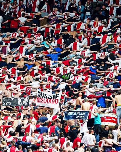 Fans of Ajax celebrate after their 32th Dutch league match against Willem II in Amsterdam, capital of the Netherlands, on May 5, 2013. Ajax won 5-0 and claimed the champion in advance. (Xinhua/Robin Utrecht) 