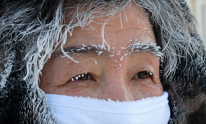 Frost appears on a woman's hair and eyebrows on Tuesday morning in Erguna, in the Inner Mongolia Autonomous Region. Temperatures fell below -38 C in Erguna and some other cities in the North China region, some as low as -43.5 C over the past three days. Photo: IC