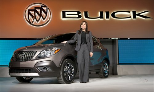 Mary Barra introduces the 2013 Buick Encore luxury crossover at an auto show in Detroit last year. Photo: IC