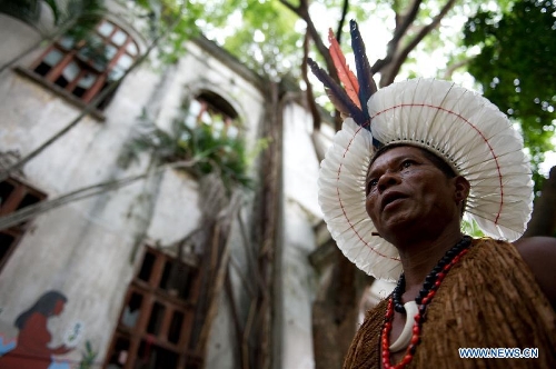 An indigenous man walks outside the old Indian Museum in Rio de Janeiro, Brazil, Jan. 16, 2013. The government of Rio de Janeiro plans to tear down an old Indian museum beside Maracana Stadium to build parking lot and shopping center here for the upcoming Brazil 2014 FIFA World Cup. The plan met with protest from the indigenous groups. Now Indians from 17 tribes around Brazil settle down in the old building, appealing for the protection of the century-old museum, the oldest Indian museum in Latin America. They hope the government could help renovate it and make part of it a college for indigenous Indians. (Xinhua/Weng Xinyang) 