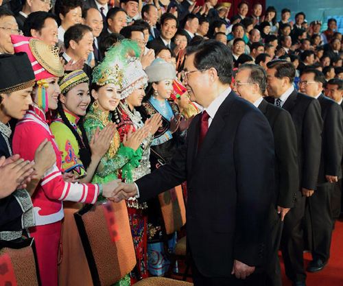 (From L to R) Chinese President Hu Jintao and other senior leaders Wen Jiabao, Jia Qinglin and Li Changchun, meet with representatives of the cast crew ahead of the opening ceremony of the fourth Minorities Art Festival of China at the National Stadium in Beijing, capital of China, June 12, 2012. The fourth Minorities Art Festival of China opened here on Tuesday evening. Photo: Xinhua