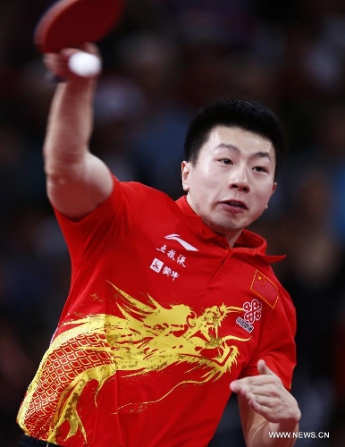 Ma Long of China competes during men's singles round of 16 against Niwa Koki of Japan at the 2013 World Table Tennis Championships in Paris, France on May 18, 2013. Ma won 4-2. (Xinhua/Wang Lili) 