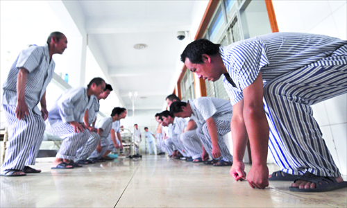 Male patients are organized into exercise groups. Photo: IC