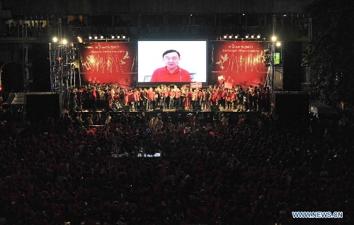 Thailand former prime minister Thaksin Shinawatra speaks to his supporters in screen via 