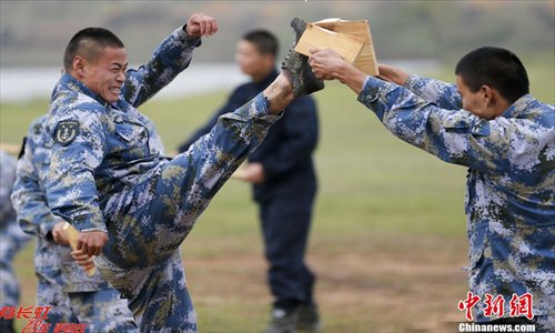 Chinese marines soldiers attend an exercise during a marines landing drill at their base in Zhanjiang, Guangdong province, December 23, 2012. The Marine Corps under the PLA Navy's South China Sea Fleet kicked off the tactical exercise of the landing drill at their base in Zhanjiang, Guangdong province. Source: Chinanews.com