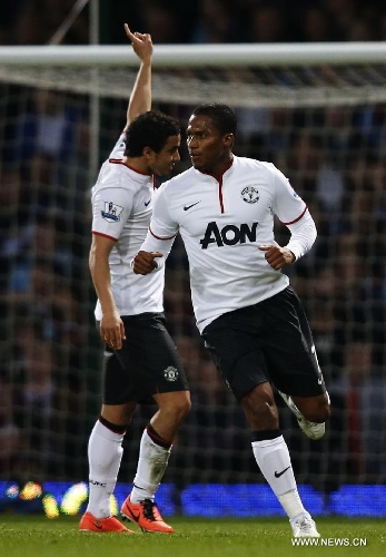 Antonio Valencia (R) of Manchester United celebrates scoring during the Barclays Premier League match between West Ham United and Manchester United at Upton Park in London, Britain, on April 17, 2013. The match ended with a 2-2 draw. (Xinhua/Wang Lili)&nbsp;
