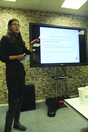 Jane Li, a member of the club, delivers an impromptu speech on happiness. Photo: Lin Kan Hsuan/GT