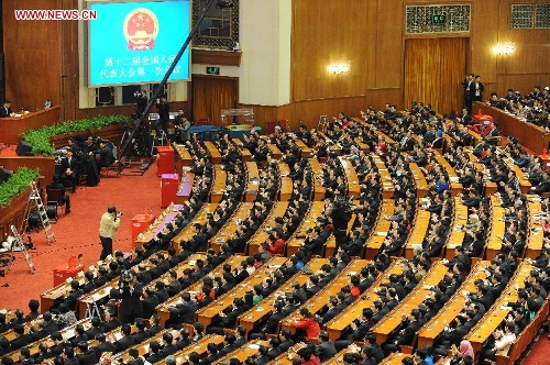 The fourth plenary meeting of the first session of the 12th National People's Congress (NPC) is held at the Great Hall of the People in Beijing, capital of China, March 14, 2013. Chairman, vice-chairpersons, secretary-general and members of the 12th NPC Standing Committee, president and vice-president of the state, and chairman of the Central Military Commission of the People's Republic of China will be elected here on Thursday. (Xinhua/Yang Zongyou)