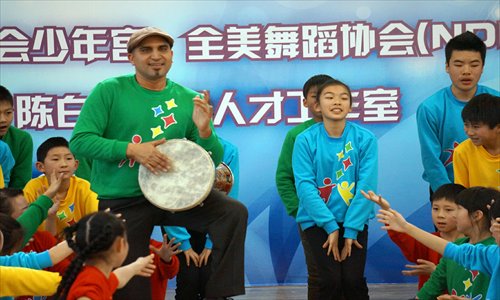 Yakir Ben-Hur with a group of young dancers Photo: Courtesy of Helen Stambler Neuberger