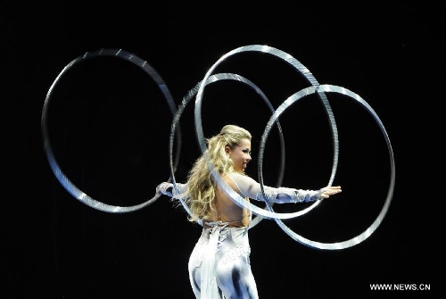An artist performs during the opening ceremony of the 5th Men's and Women's Artistic Gymnastics Individual European Championships in Moscow, Russia, April 17, 2013. The event kicked off here on Wednesday. (Xinhua/Jiang Kehong) 