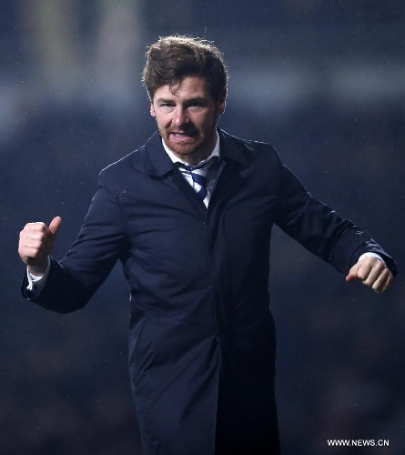 Andre Villas-Boas, manager of Tottenham Hotspur, celebrates after player Gareth Bale scoring the winning goal during the Barclays Premier League match between West Ham United and Tottenham Hotspur at the Boleyn Ground, Upton Park, in London, Britain on February 25, 2013. Tottenham Hotspur won 3-2 and lift into third in the table. (Xinhua/Wang Lili)  