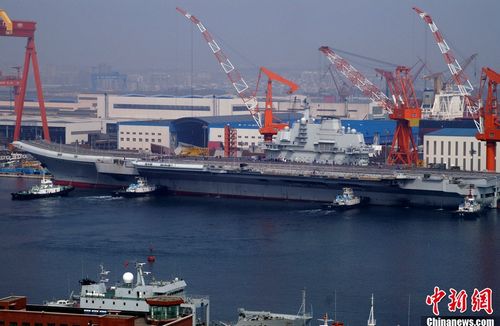 China's first aircraft carrier is refitted at the port of Dalian. The carrier, built on former Ukrainian vessel Varyag, is capable of carrying around 30 fixed wing fighters and helicopters and a crew of about 2,000. And the hull number, 