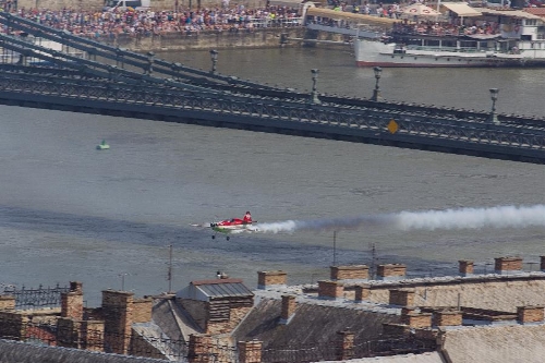 Aerobatic European Champion Zoltan Veres of Hungary flies with his airplane under the Chain Bridge during an air show above river Danube crossing central Budapest, Hungary, on May 1, 2013. (Xinhua/Attila Volgyi) 