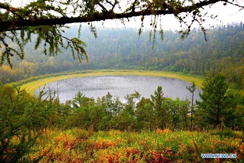 Photo taken on August 27, 2012 shows a volcanic lake in Chaihe scenic spot in Zalantun City, north China's Inner Mongolia Autonomous Region. Chaihe scenic spot is famous for its volcanic landform and primeval forest. Photo: Xinhua
