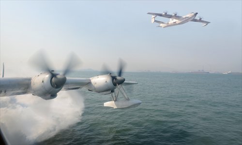 Two Chinese SH-5 seaplanes, attached to the North Sea Fleet navy aviation unit, take off on their first training following Spring Festival.  The planes are mainly engaged in surveillance of China's coastal waters. Photo: CFP