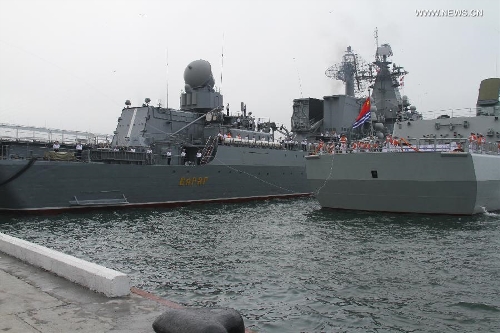Destroyer Shenyang (R) of the Chinese People's Liberation Army (PLA) Navy is anchored in Vladivostok, Russia, July 5, 2013. Chinese fleet consisting of seven naval vessels arrived in Vladivostok on Friday to participate in Sino-Russian joint naval drills scheduled for July 5 to 12 at the sea area and airspace of the Peter the Great Gulf in the Sea of Japan. (Xinhua/Wang Jingguo)