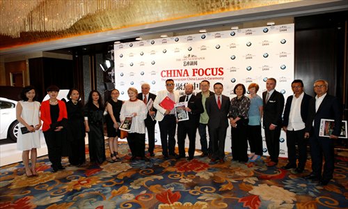 Representatives from BMW and The Art Newspaper attend a ceremony on May 13 marking the launch of the publication's Chinese-language edition. Photo: Courtesy of BMW