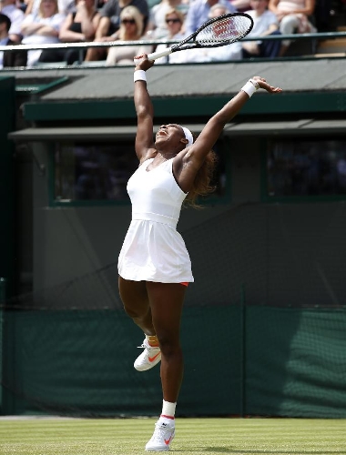 Serena Williams of the United States celebrates during the second round of ladies' singles against Caroline Garcia of France on day 4 of the Wimbledon Lawn Tennis Championships at the All England Lawn Tennis and Croquet Club in London, Britain on June 27, 2013. Serena Williams won 2-0. (Xinhua/Wang Lili) 