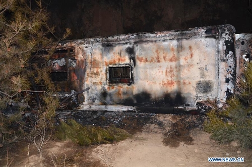 Photo taken on Feb. 1, 2013 shows the damaged bus after an accident occured in Ningxian County of Qingyang city, in northwest China's Gansu Province. (Xinhua/Wang Zhaofeng) 