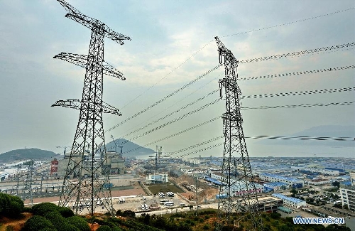 Electricity transmission towers are pictured near the Ningde Nuclear Power Plant in Ningde, southeast China's Fujian Province, April 18, 2013. The nuclear power plant made its generator No. 1 begin operating on Thursday, making it the first of its kind in the province. Ningde nuclear power plant, with four generators in the first phase of construction, is co-funded and jointly run by Guangdong Nuclear Power Group, Datang International Power Generation Co. Ltd., and Fujian Energy Group Co. Ltd. (Xinhua/Zhang Guojun) 
