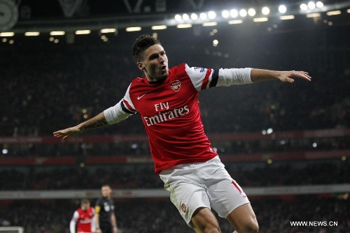Oliver Giroud of Arsenal celebrates his first goal during the English Premier League football match between Arsenal and West Ham United at the Emirates Stadium in London, Britain, on Jan. 23, 2013. Arsenal won 5-1.(Xinhua/Wang Lili)&nbsp; 