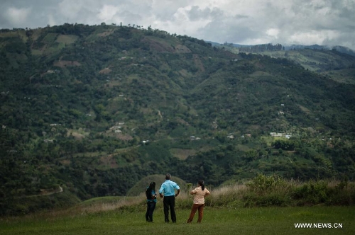 People observe the San Agustin town in Huila, Colombia, on March 31, 2013. San Agustin Archaeological Park is located in the southern Colombian Department of Huila, which will celebrate its centenary and being denominated as World Cultural Heritage in 1995 by United Nations Educational, Scientific and Cultural Organization (UNESCO) this year. (Xinhua/Jhon Paz)