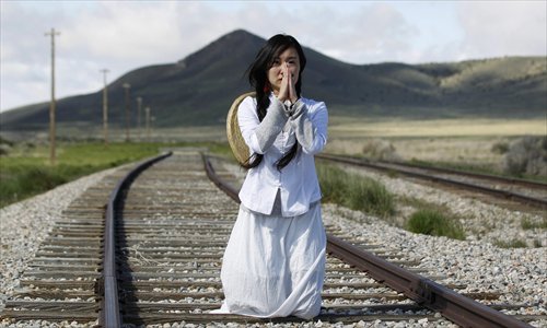 Wan Zhao, a New York dancer and actress, says a prayer for her ancestors on the tracks they helped build. The trails connected the industrial east and resource-bountiful west for the first time on May 10, 1869 after nearly five years' construction. They reduced a trip that used to take six months by wagon to only six days.