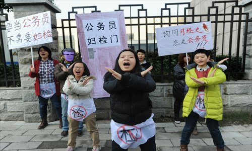 University students protest invasive screening practices in front of the Human Resources and Social Security Department of Hubei Province on Monday. Photo: IC