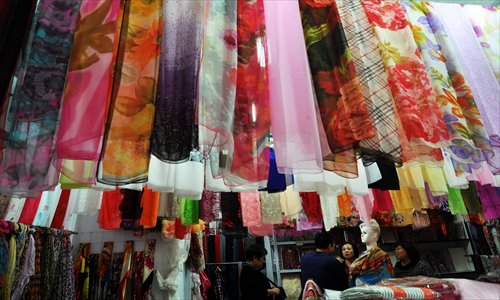 Colorful silk scarves on display in a shop. Silk products are always a popular souvenir choice for tourists in China. Photo: CFP