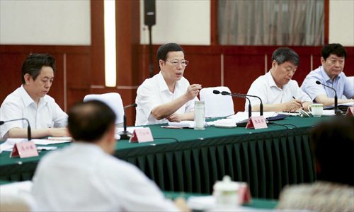Chinese Vice Premier Zhang Gaoli (3rd R.) presides over an economic conference in Chengdu, capital of southwest China's Sichuan Province, July 6, 2013. Zhang made a research tour in Sichuan from July 5 to July 8.  Photo: Xinhua