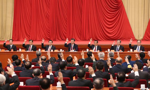Xi Jinping (center), General Secretary of the Communist Party of China Central Committee, and other members of the Central Committee attend the Sixth Plenary Session of the 18th CPC Central Committee in Beijing Thursday. Photo: Xinhua