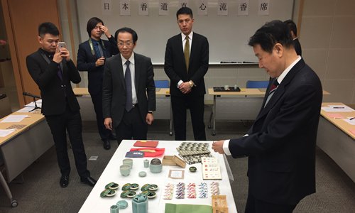 Japanese incense ceremony experts show how to make incense during the event. Photo: Yin Yeping/GT
