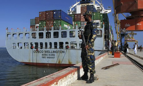 A Pakistani soldier stands guard as a loaded Chinese ship is ready for departure at the Gwadar Port, Pakistan on November 13. Photo: IC