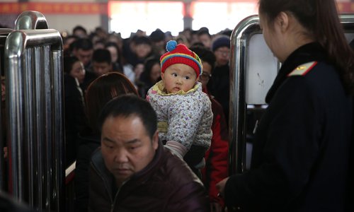 Passengers wait to enter the train station in Handan, Hebei Province on Thursday as the weeklong Spring Festival holidays wrap up. Photo: IC