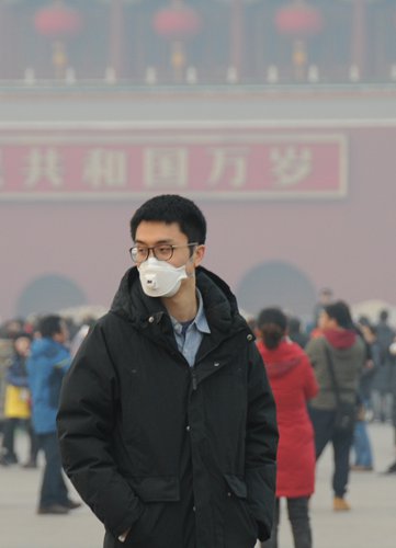 A visitor to Tiananmen Square in Beijing wears a face mask on the first day of the Lunar New Year. Photo: CFP