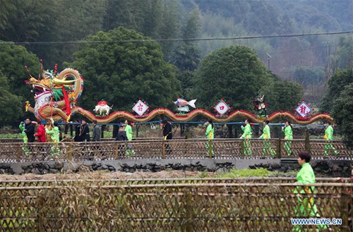 Wooden-bench dragon dance performed to celebrate Chinese Lantern ...