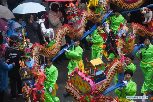 Wooden-bench dragon dance performed to celebrate Chinese Lantern ...