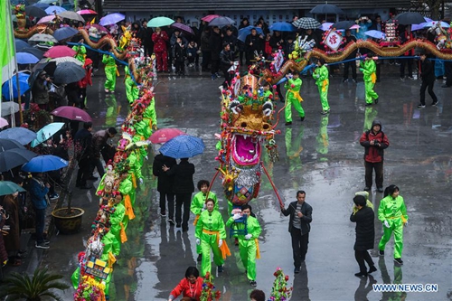 Wooden-bench dragon dance performed to celebrate Chinese Lantern ...
