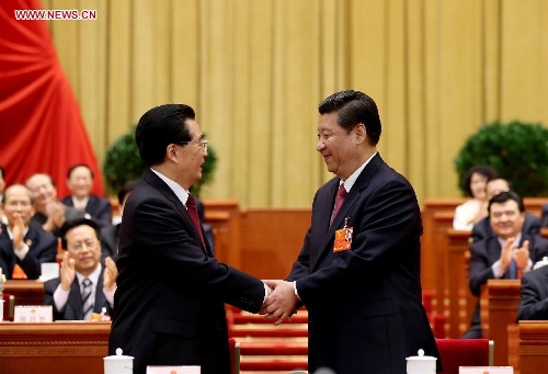 Hu Jintao (L) congratulates Xi Jinping at the fourth plenary meeting of the first session of the 12th National People's Congress (NPC) in Beijing, capital of China, March 14, 2013. Xi was elected president of the People's Republic of China (PRC) and chairman of the Central Military Commission of the PRC at the NPC session here on Thursday. (Xinhua/Lan Hongguang)